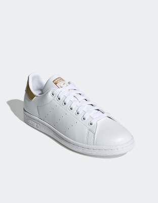 adidas Originals Stan Smith trainers in white/gold