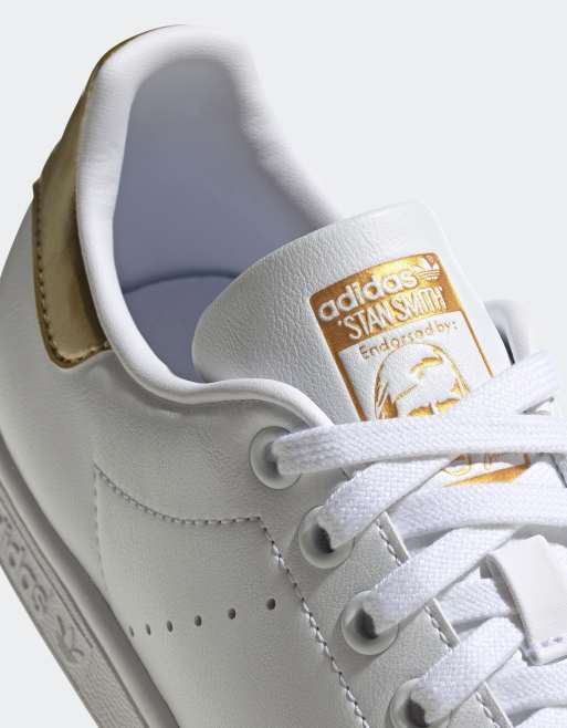 adidas Originals Stan Smith trainers in white gold