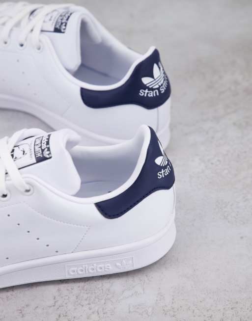 Adidas originals stan smith shop trainers in white and navy