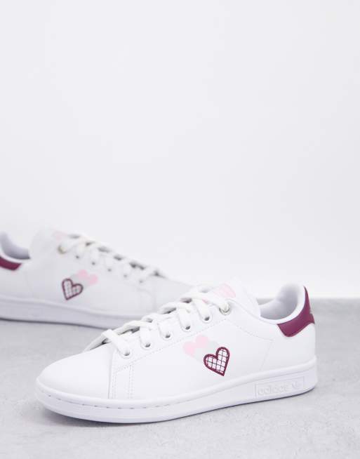 adidas Originals Stan Smiths in white and burgundy with heart print