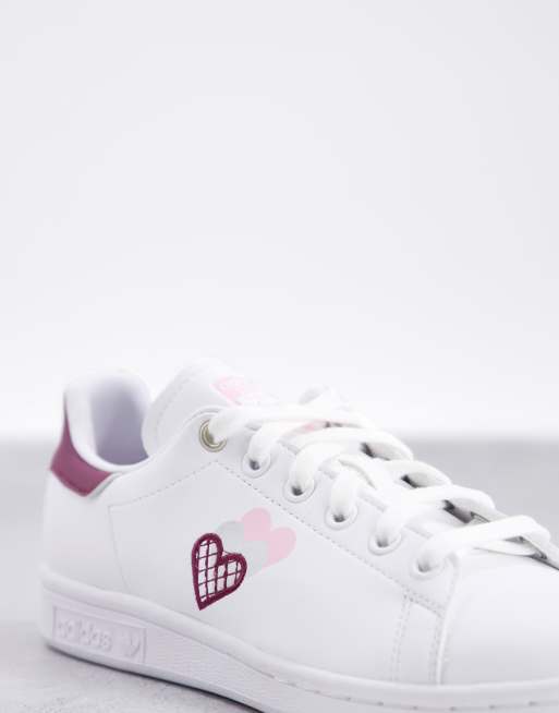 adidas Originals Stan Smiths in white and burgundy with heart print