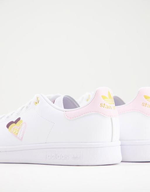 adidas Originals Stan Smiths in white and pink with heart print