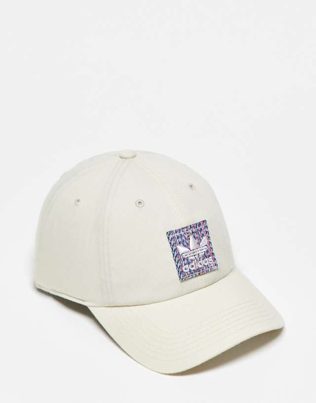 adidas Originals strapback cap with woven patch in beige