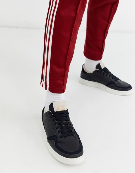 adidas Originals Supercourt sneakers in black