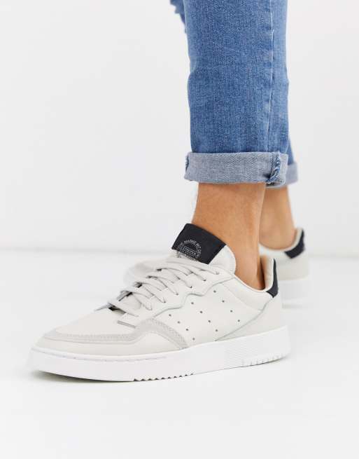 Adidas originals supercourt on sale trainers in off white