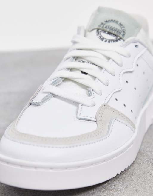 adidas Originals Supercourt sneakers in white dash green core