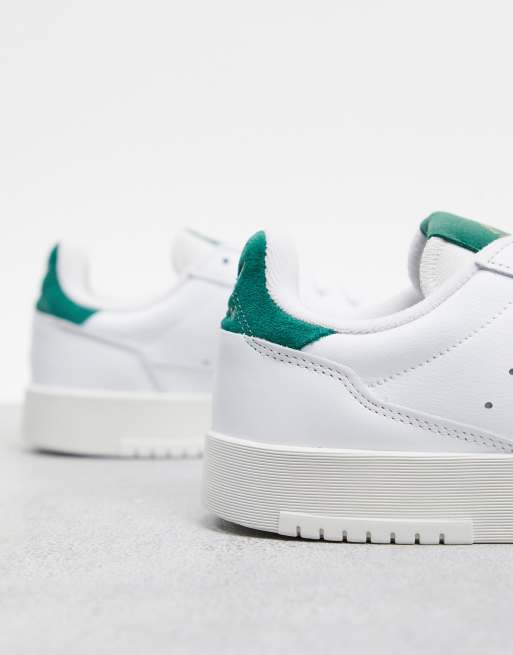 adidas Originals supercourt sneakers in white with suede trim