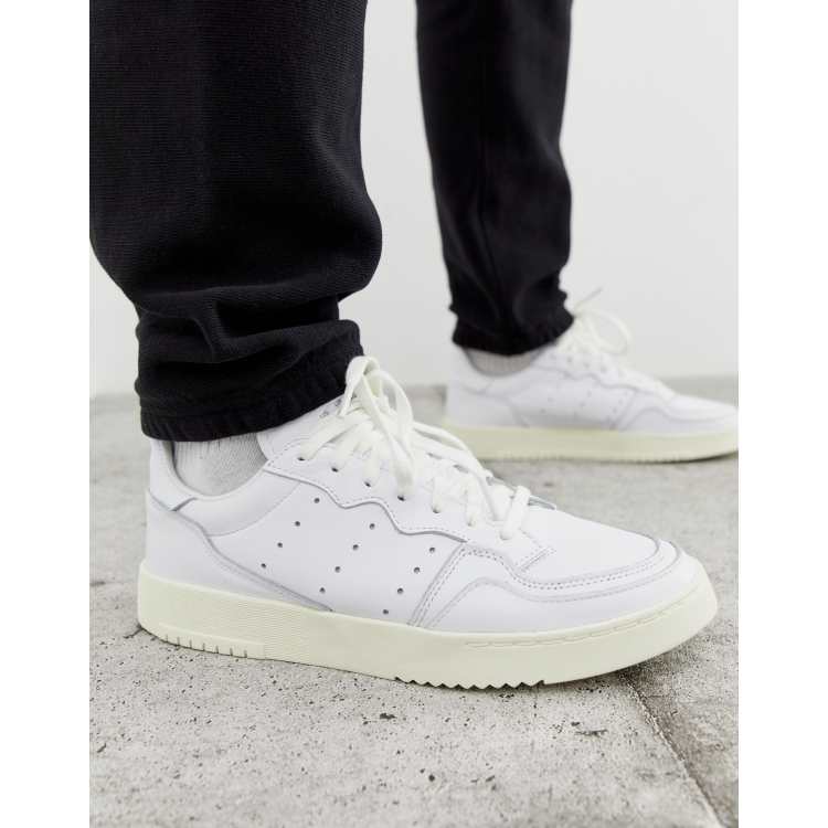 Adidas originals supercourt rx sneakers in white x home of classics clearance edition