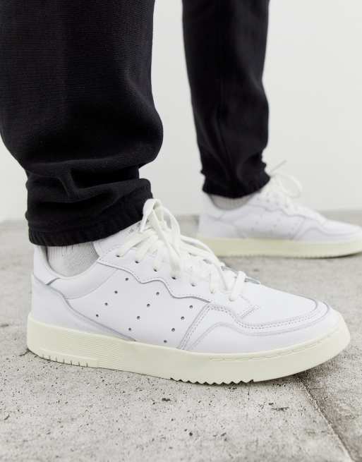 adidas Originals SuperCourt sneakers in white X home of classics edition