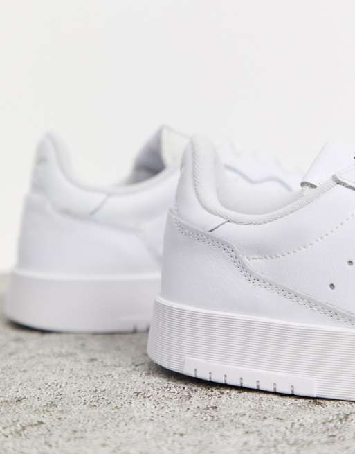 adidas Originals Supercourt sneakers in white