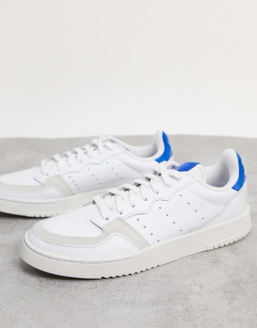 adidas Originals Supercourt trainers in white team royal blue