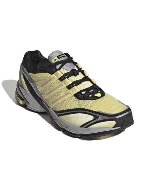 adidas Originals Supernova Cushion trainers in yellow and black | ASOS