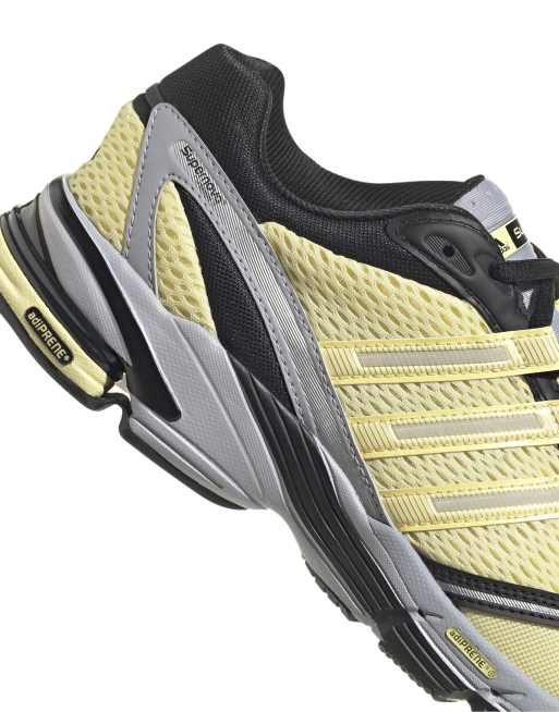 adidas Originals Supernova Cushion trainers in yellow and black