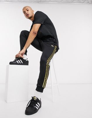 black and gold adidas tracksuit