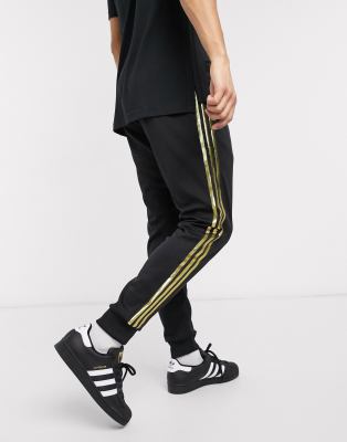 black and gold adidas sweatpants