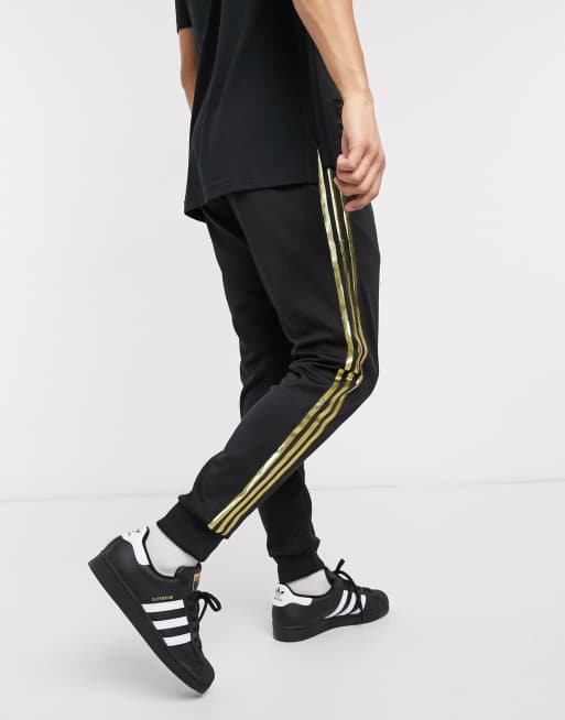 adidas Originals Superstar 24K sweatpants in black and gold ASOS