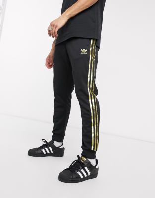 black and gold adidas sweatpants