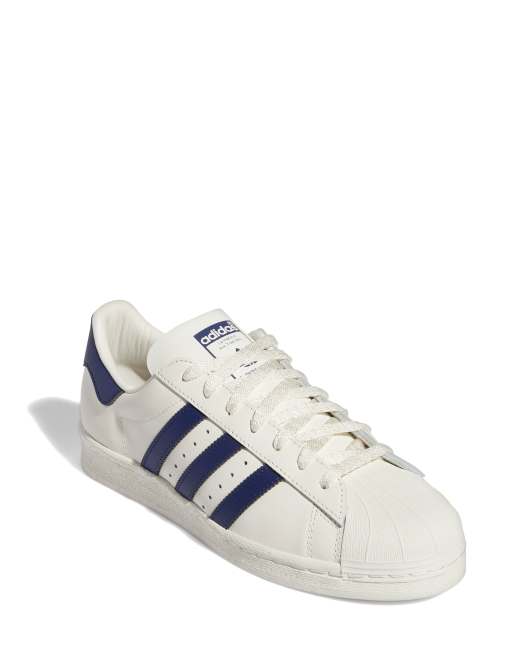 Adidas superstar blanche store et bleu marine