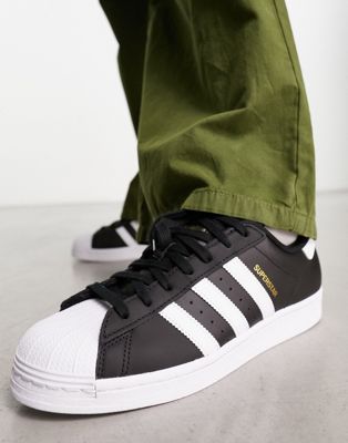 adidas Originals Superstar trainers in black with white stripes - ASOS Price Checker