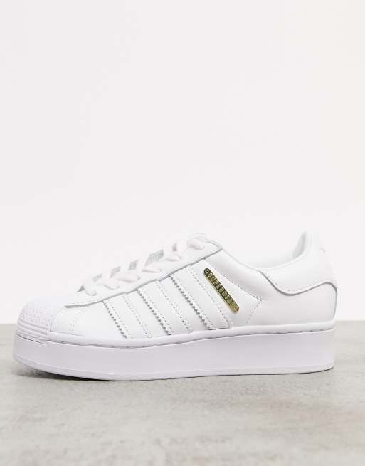 adidas Originals Superstar Bold Premium sneakers in white with gold ...