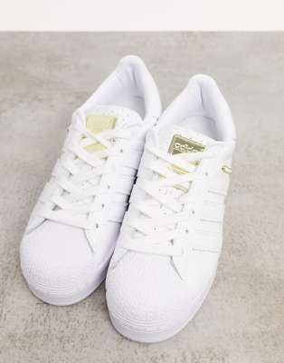 white and gold adidas trainers