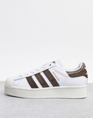 white and brown adidas