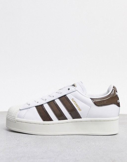 adidas Originals Superstar bold style trainers in white and brown