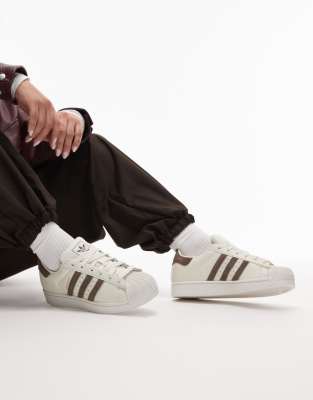 adidas Originals Superstar II trainers in white with pony hair stripes in brown