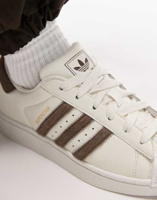 adidas Originals Superstar II trainers in white with pony hair stripes in  brown | ASOS
