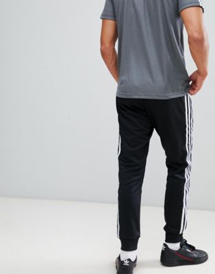 adidas originals superstar skinny joggers cuffed in black