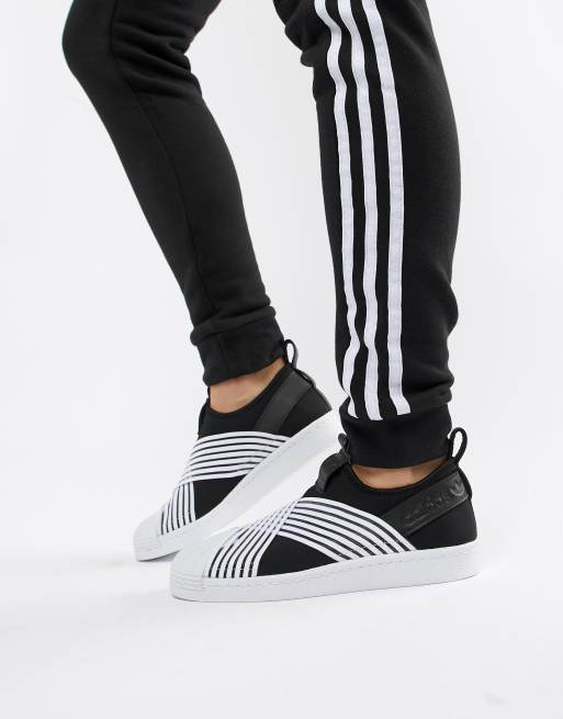 Adidas black and store white slip on