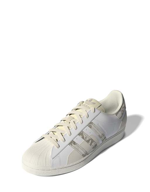 adidas Originals Superstar snake print trainers in white and beige