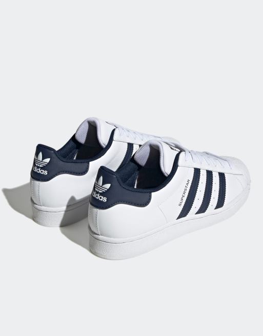 Adidas superstar bianche store e blu scuro