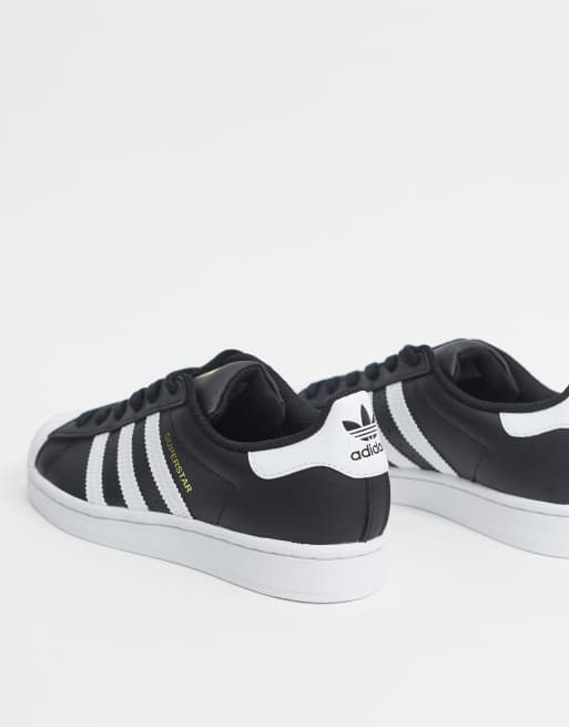 adidas Originals Superstar sneakers in black and white