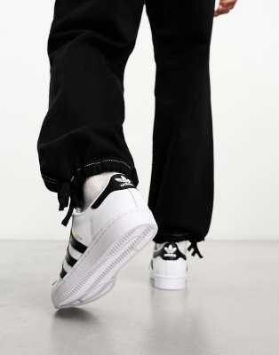 white & black superstar sneakers