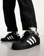 Adidas star online negras