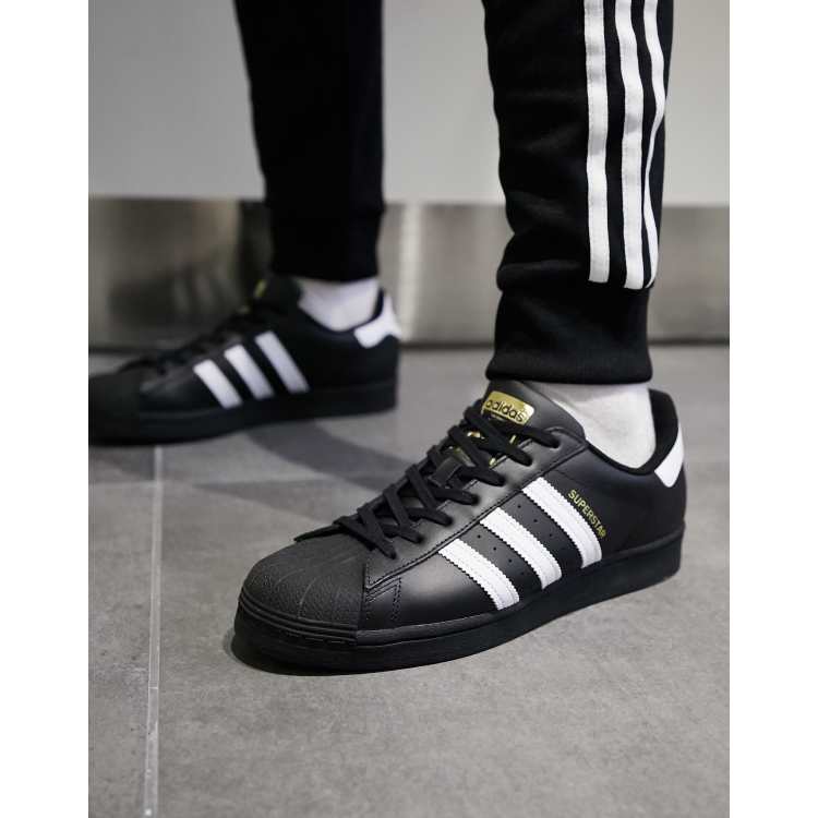 Strippen Gearceerd gebied adidas Originals Superstar sneakers in black | ASOS