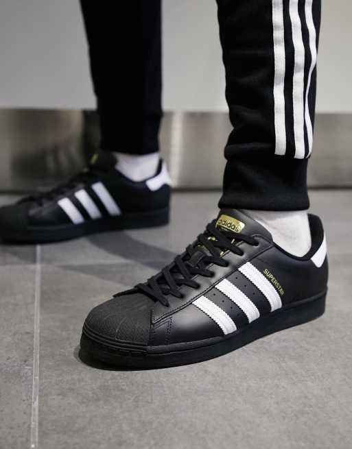 Strippen Gearceerd gebied adidas Originals Superstar sneakers in black | ASOS