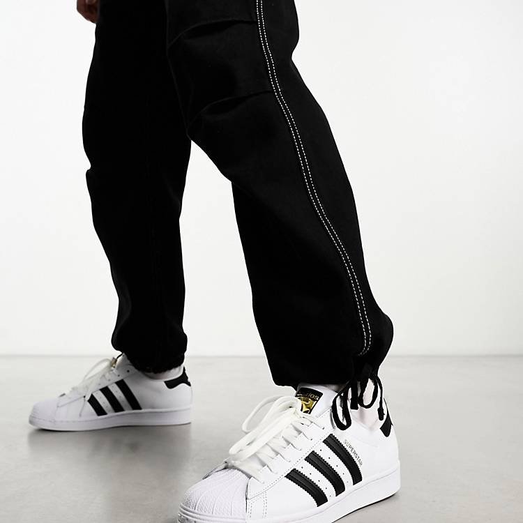 throw away I have an English class Mechanics adidas Originals Superstar sneakers in white and black | ASOS