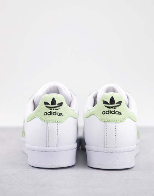 adidas Originals Superstar sneakers in white and green