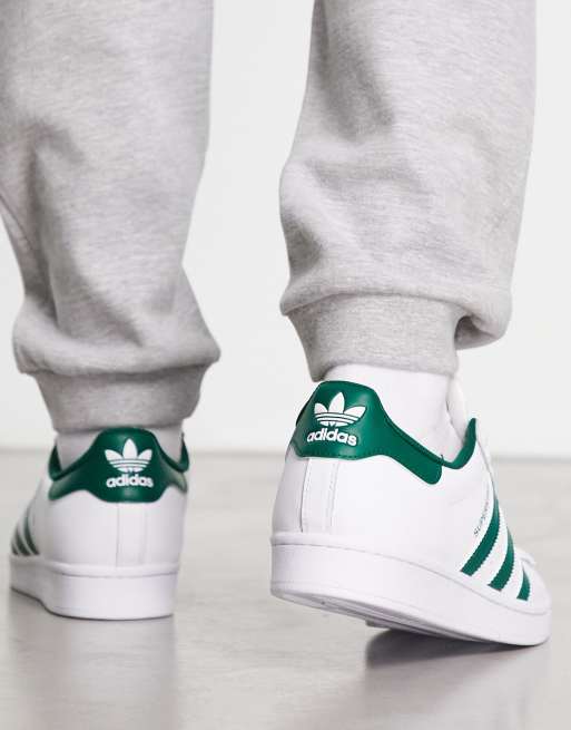 Green and white adidas on sale trainers