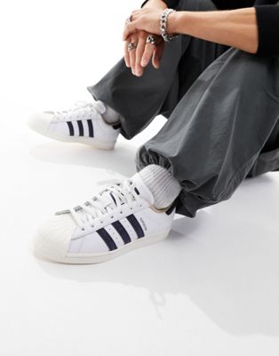 adidas Originals Superstar trainers in white and navy - ASOS Price Checker