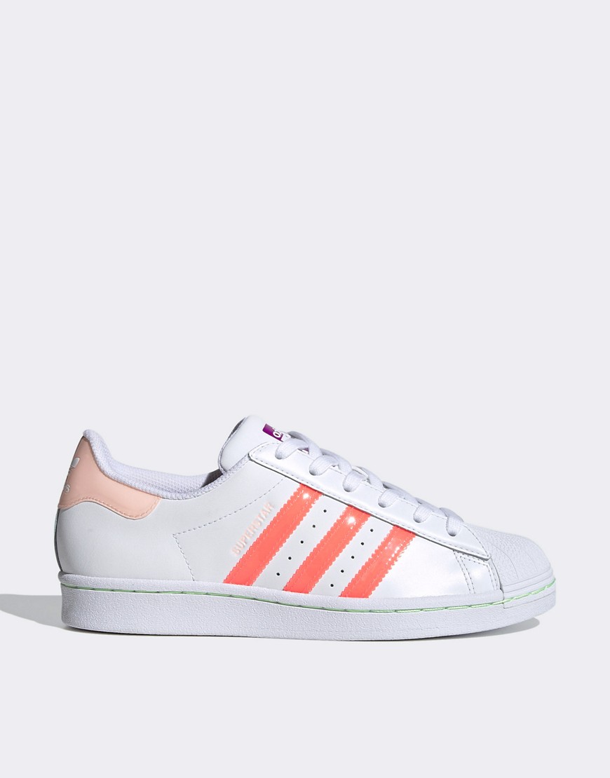 Adidas Originals Superstar sneakers in white and pink