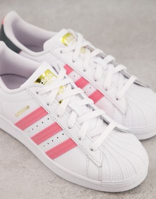 pink and white adidas superstars