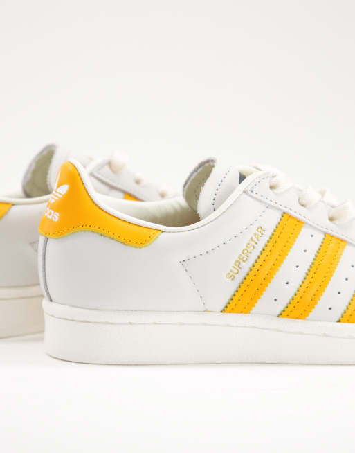 Adidas white and yellow trainers on sale