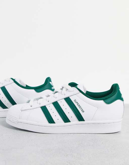 adidas Originals Superstar sneakers in white with collegiate green stripes