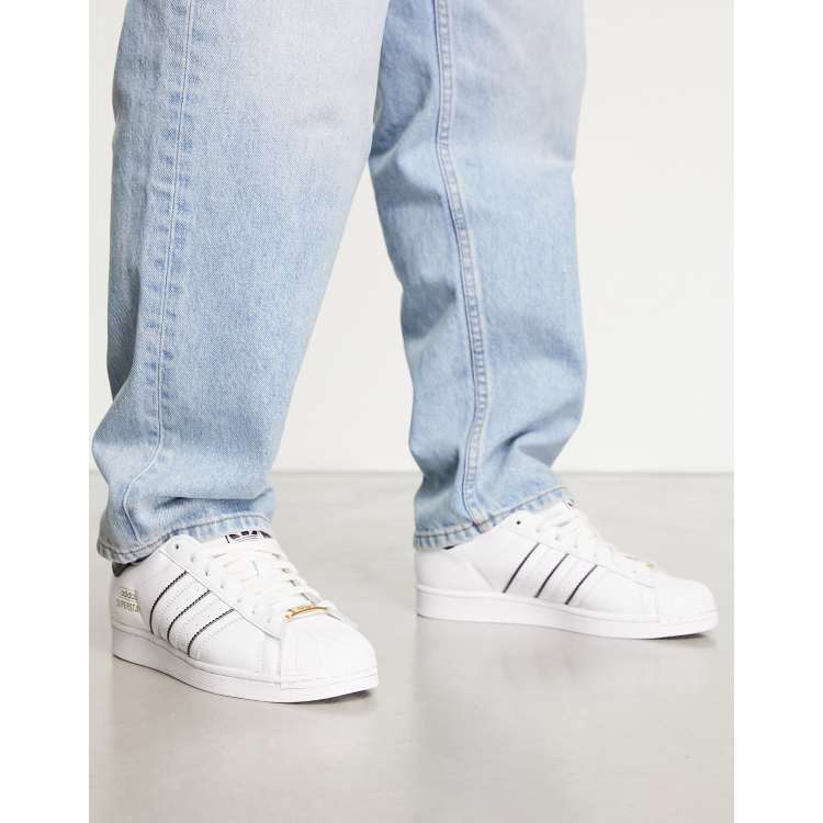 adidas Originals Superstar sneakers in white with contrast stripes