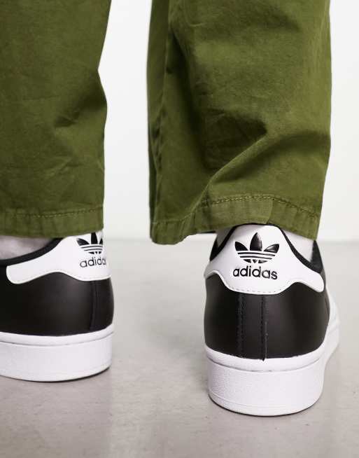 Adidas superstar zwart store met witte strepen