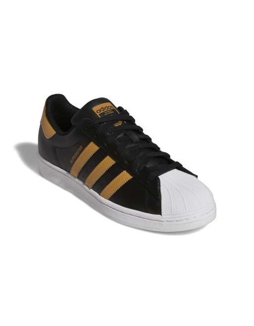 adidas Originals Superstar Sneakers nere e beige ASOS