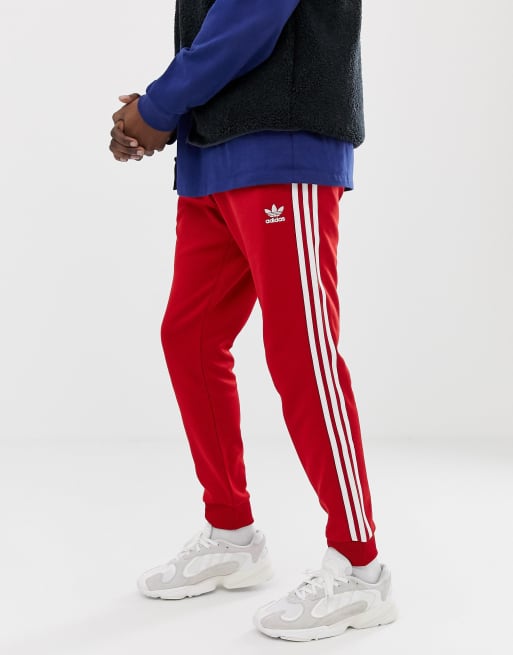 Adidas superstar track pants on sale red